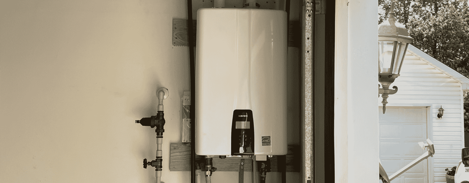 white water heater installation on a house with beige interior walls